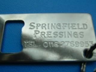 pressed-metal-botton-opener